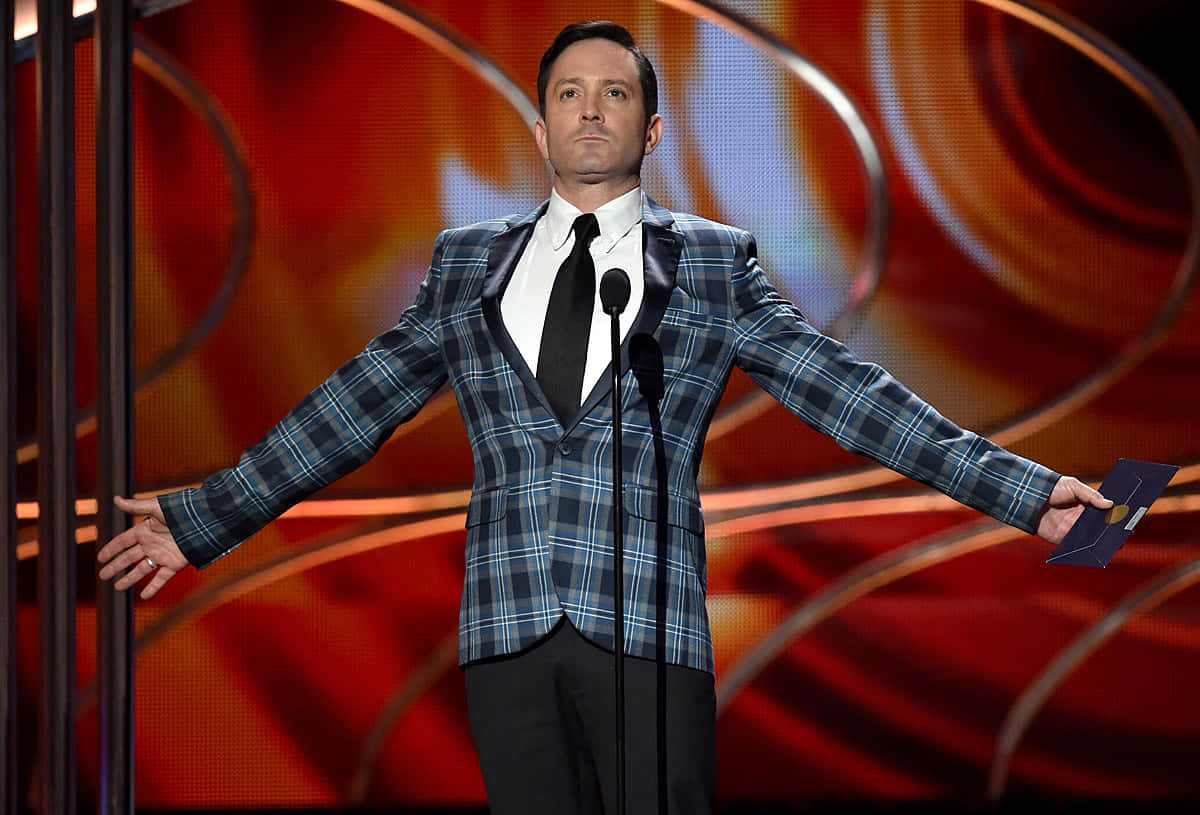 Caption: Renowned Actor Thomas Lennon in a Sophisticated Pose Wallpaper