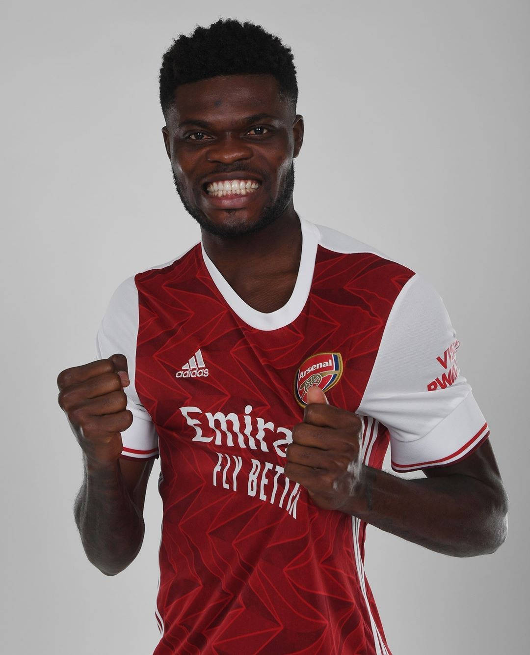 Thomas Partey Cheering With A White Backdrop Wallpaper