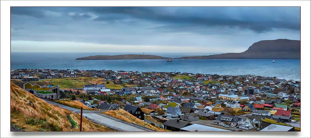Thorshavn With Ocean And Island Background Wallpaper