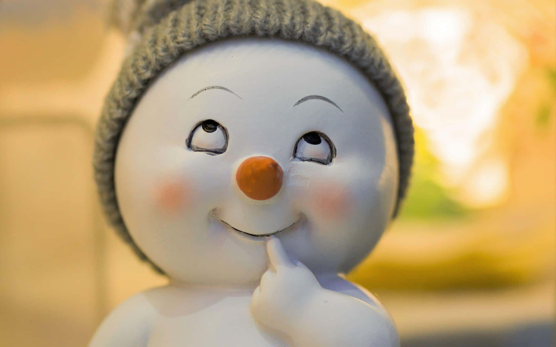 Download Thoughtful Snowman Figurine Wallpaper | Wallpapers.com