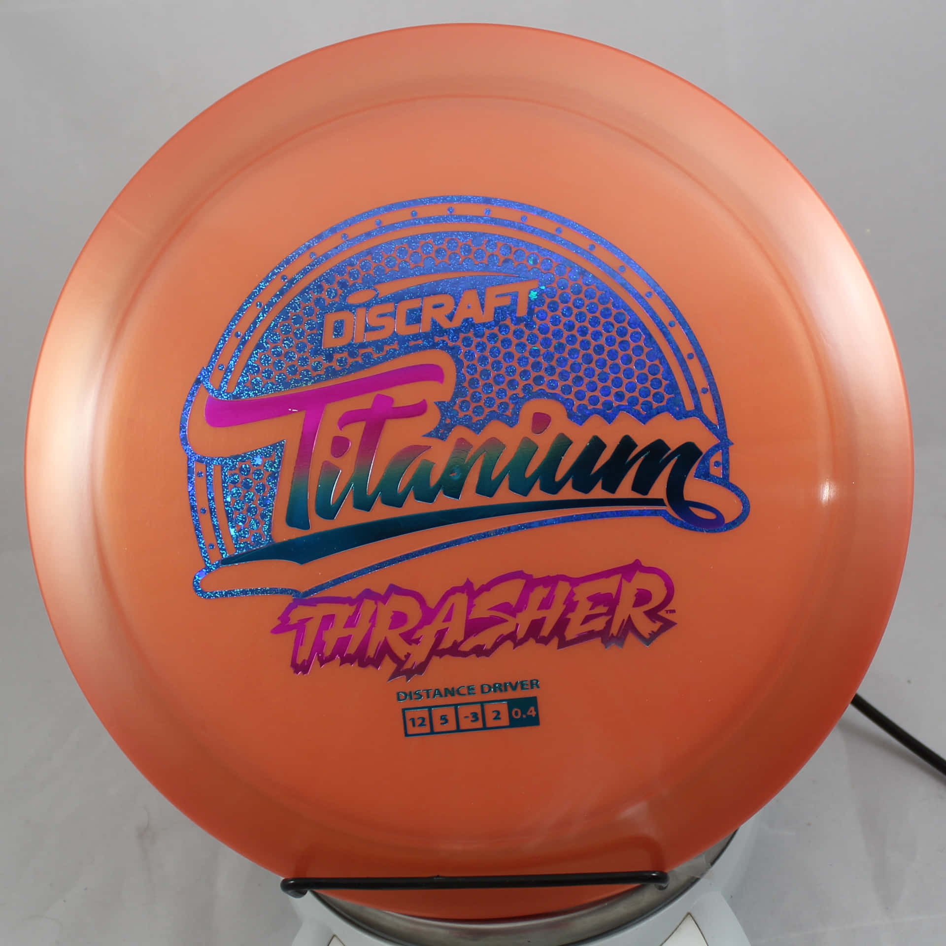 A Disc With The Word Thrasher On It