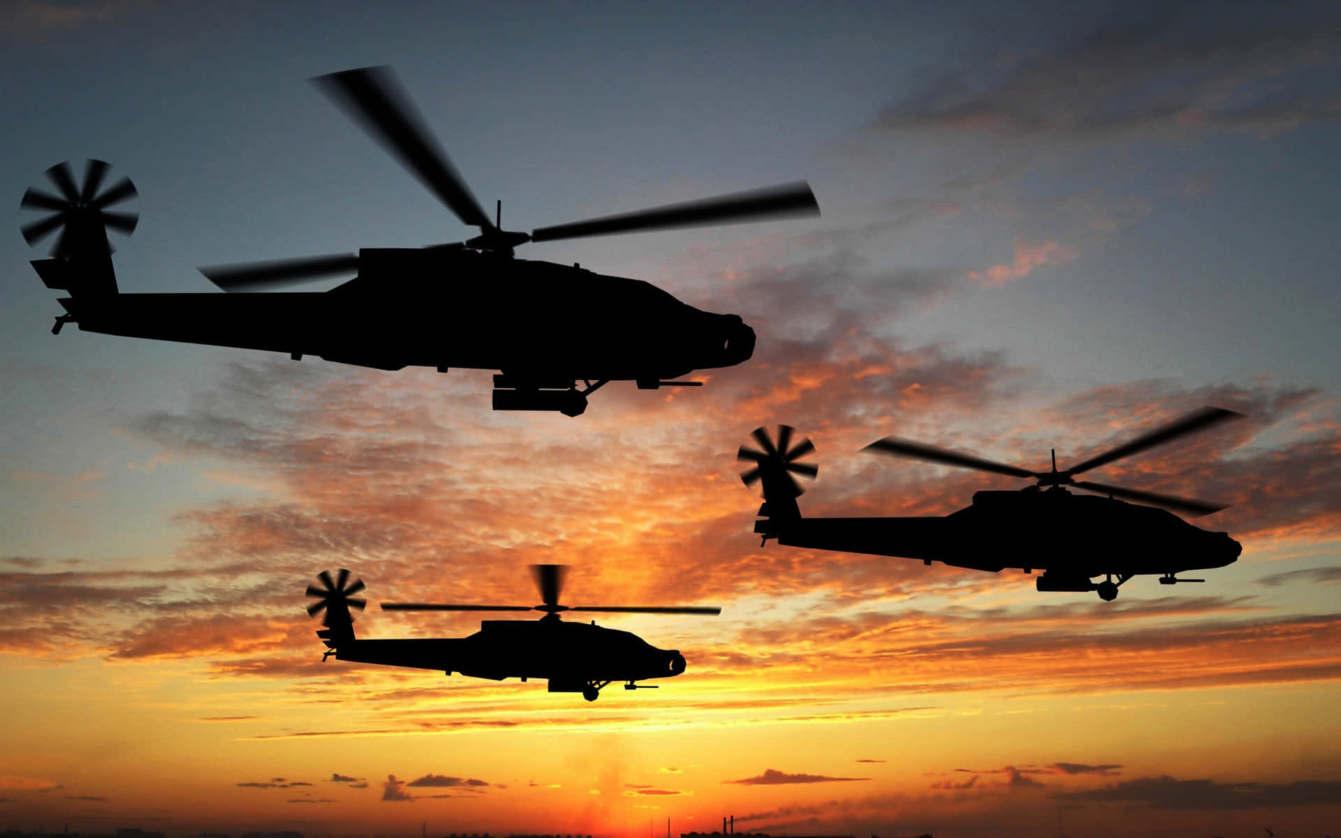 Tre Boeing AH-64 Apache Cool helikoptere zoomer tværs over en matchæske himmel. Wallpaper