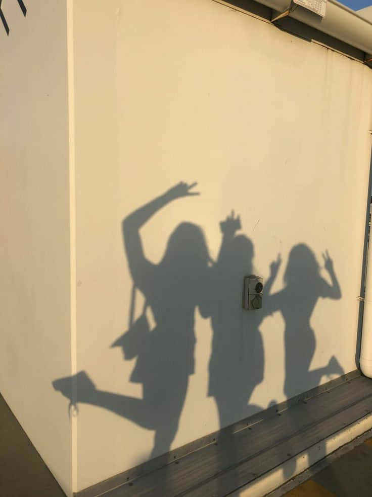 Three Friends Jump Shadow Picture