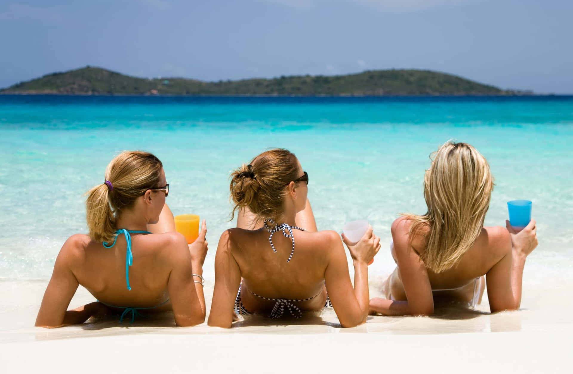 Three Girls On Beach Relaxing Wallpaper