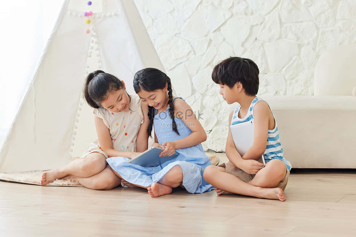 Three Kids Playing Sit Down Wallpaper