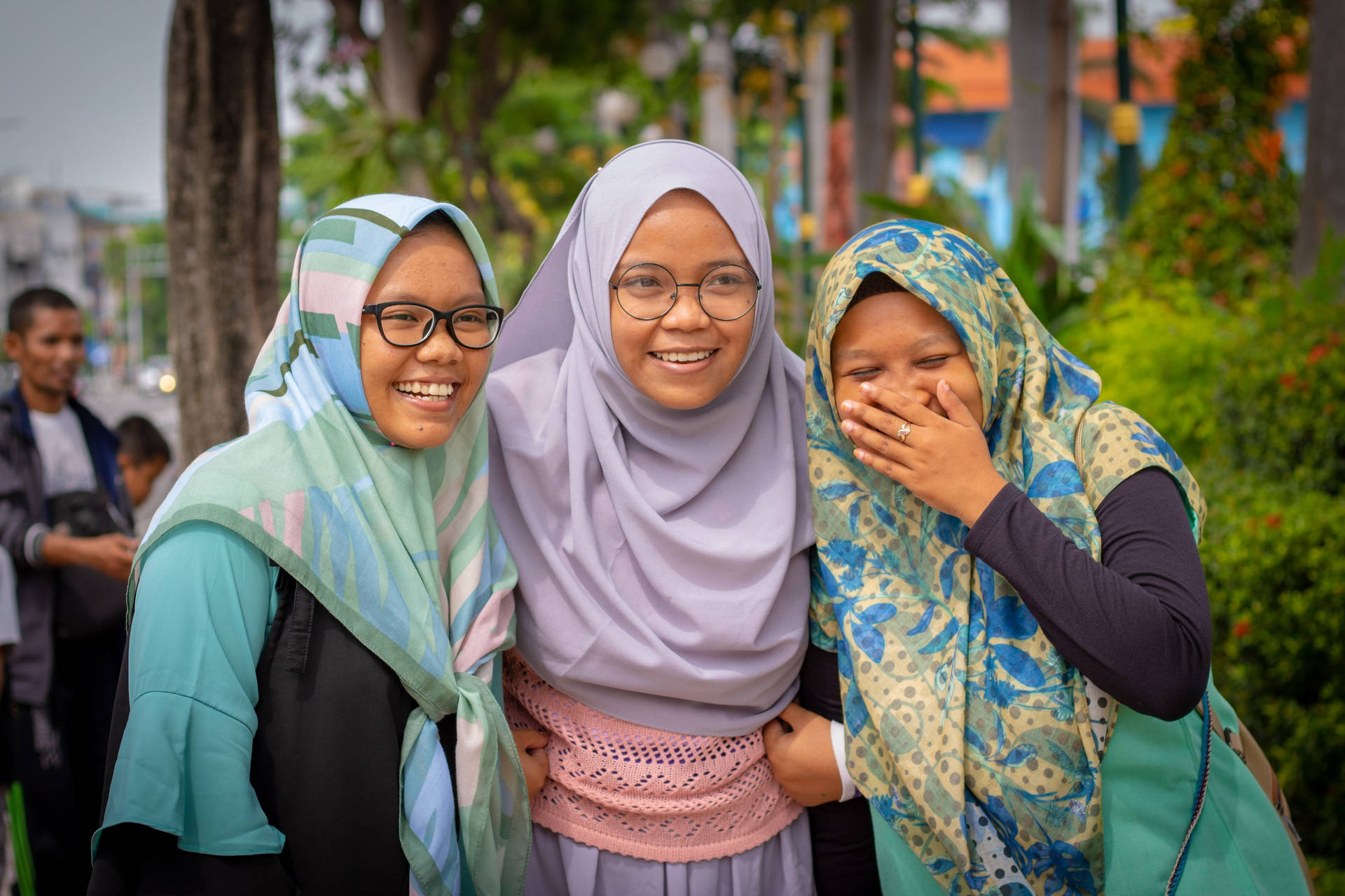 Three Muslim Teenagers Laughing Wallpaper