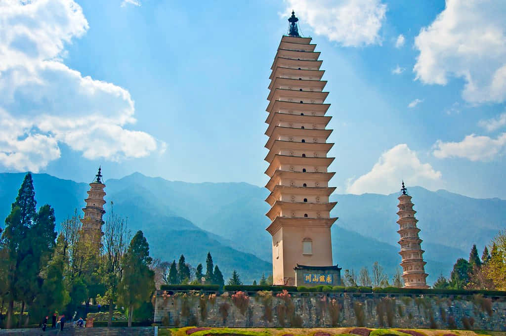 Three Pagodas Under Bluish Sky Wallpaper