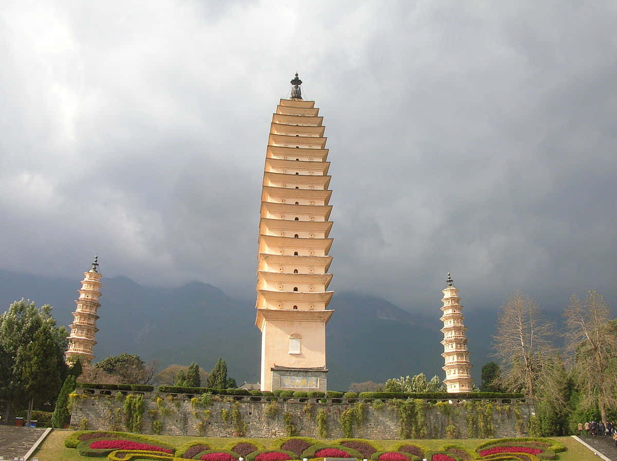 Three Pagodas Under Gloomy Sky Wallpaper