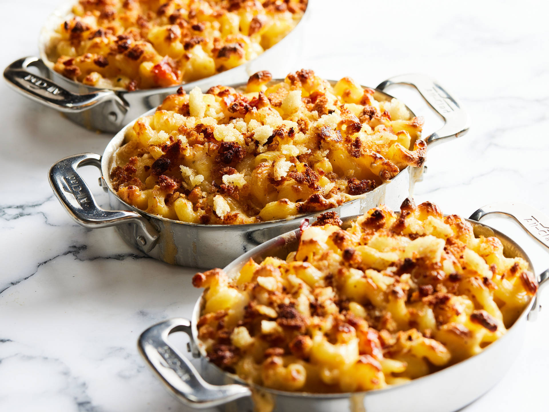 Three Pans Of Baked Mac And Cheese Wallpaper