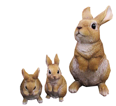 Three Rabbit Figurines Black Background PNG