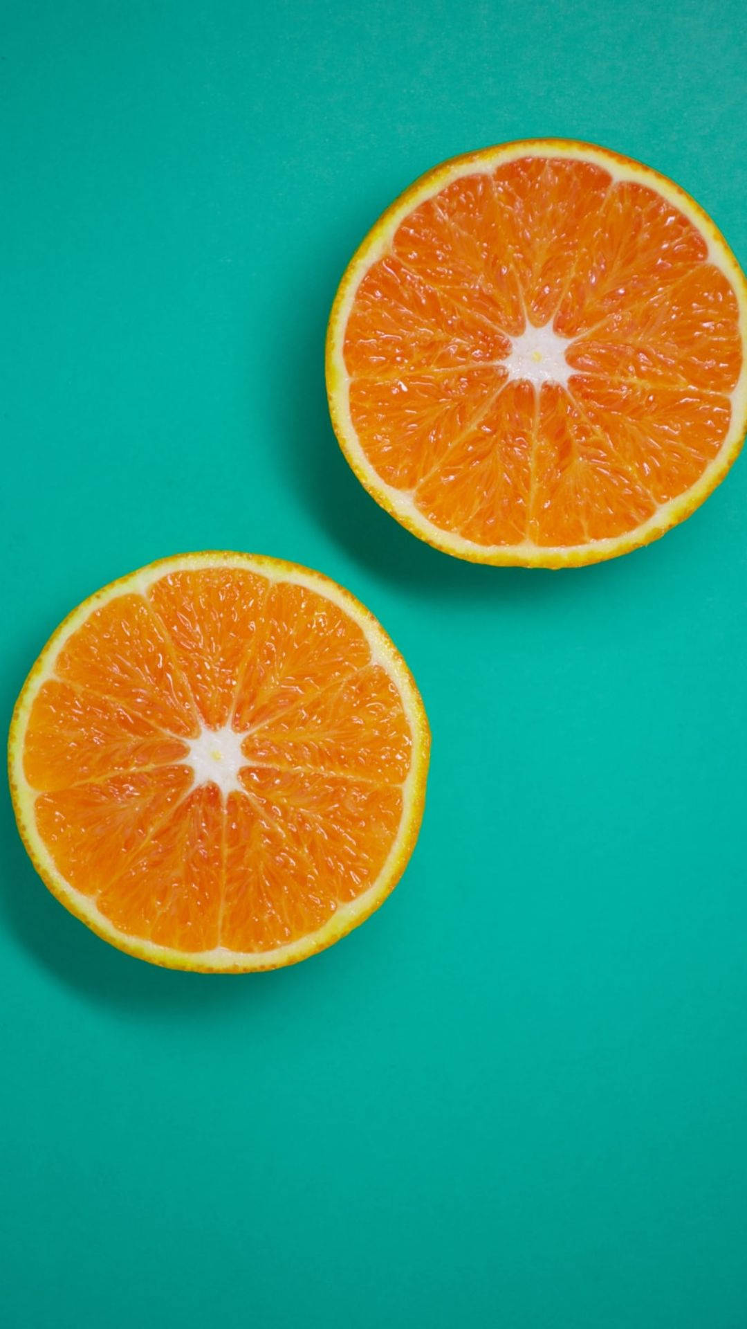Three Sliced Orange Fruits