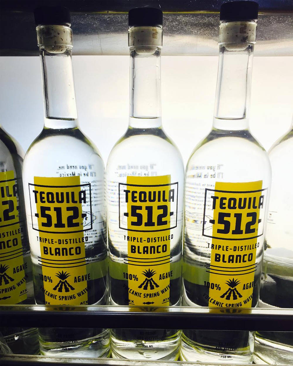 Three Tequila 512 Blanco Bottles Wallpaper