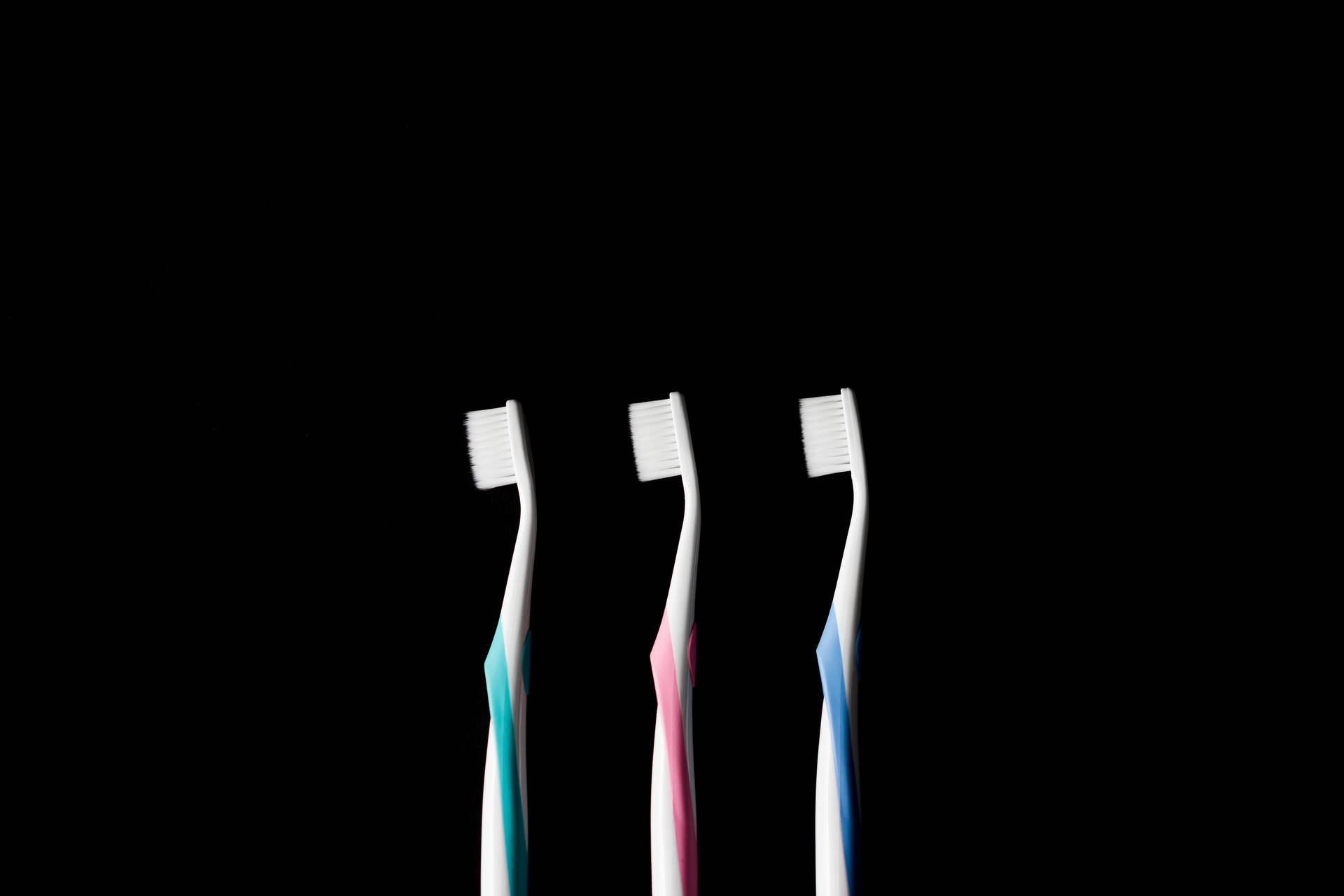Tre tandbørster dentisteri logo - slående tapet Wallpaper