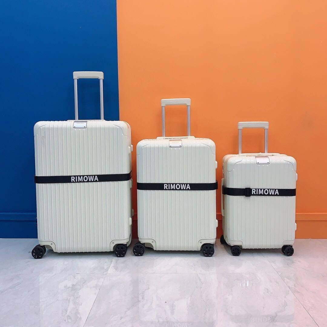 Three White Rimowa Suitcases Wallpaper