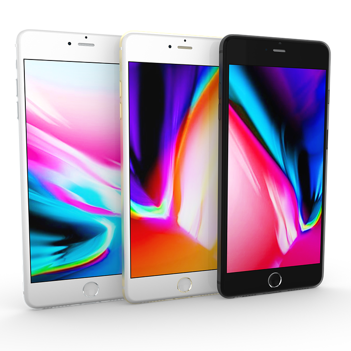 Threei Phone Models Displaying Colorful Wallpapers PNG