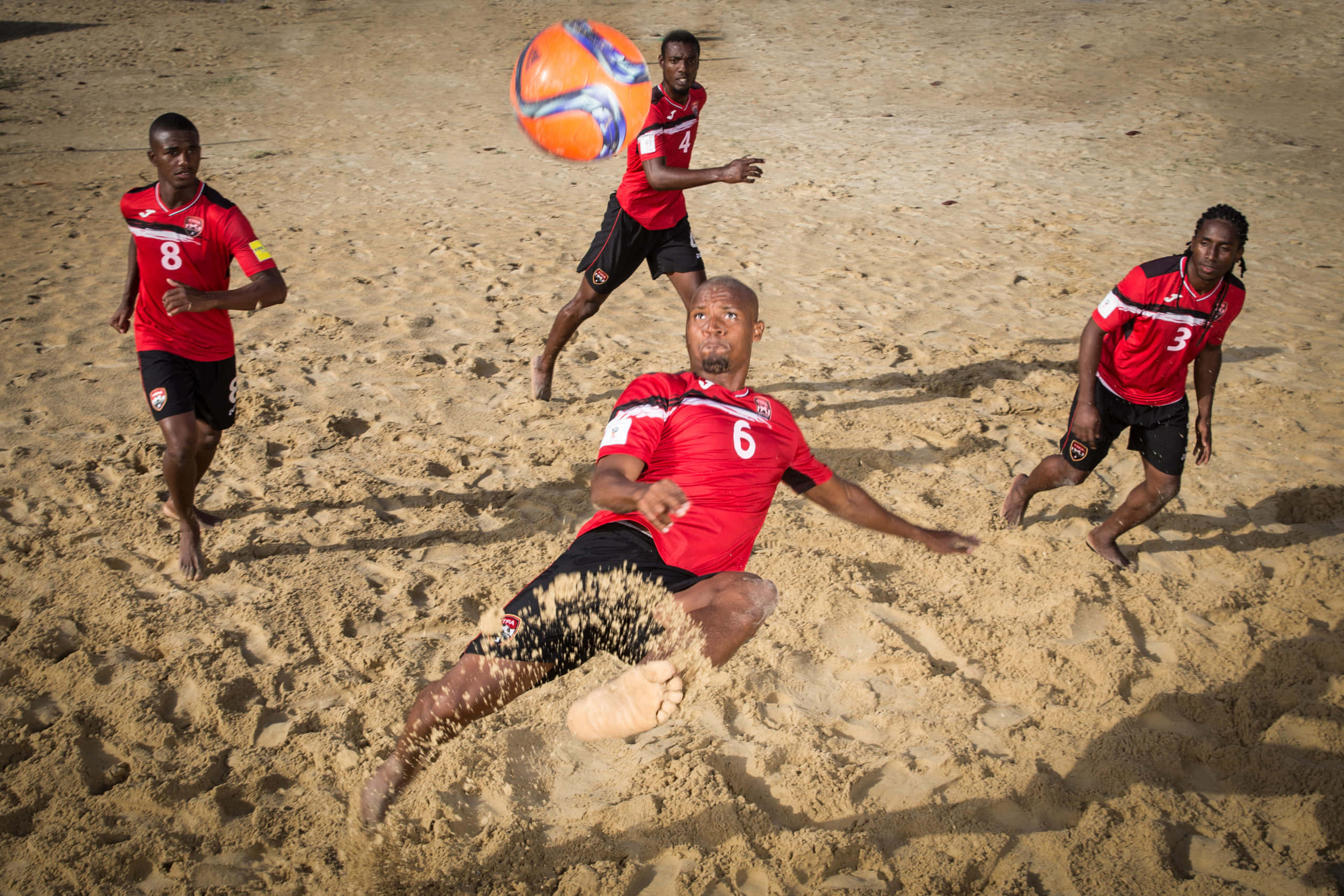 Thrilling Action At A Beach Soccer Match Wallpaper
