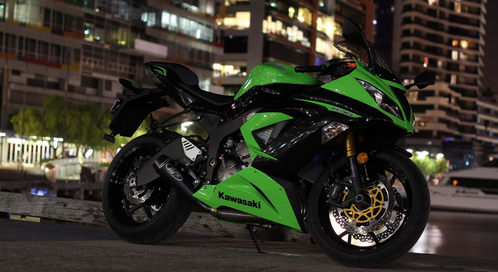 Thrilling Speed - Kawasaki Ninja Motorcycle On Road Wallpaper
