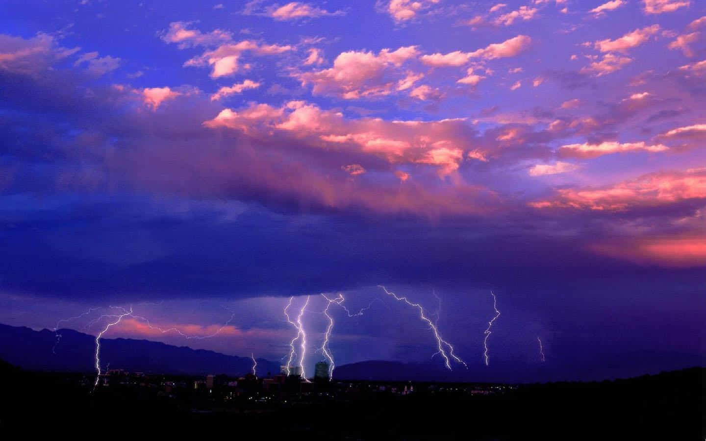 Awe-inspiring Thunderstorm Over A Darkened Landscape