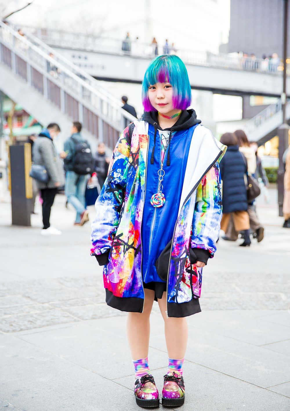 A Girl With Colorful Hair Standing On The Street