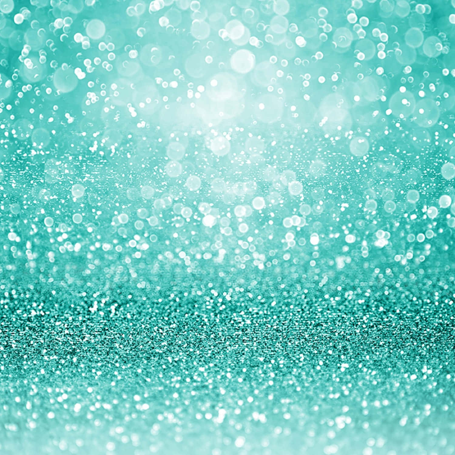 A Turquoise Glitter Background With White Bokeh