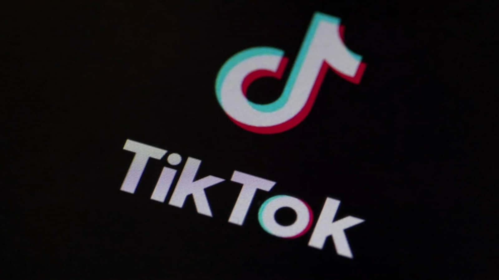 TikTok logo ses på en sort skærm Wallpaper