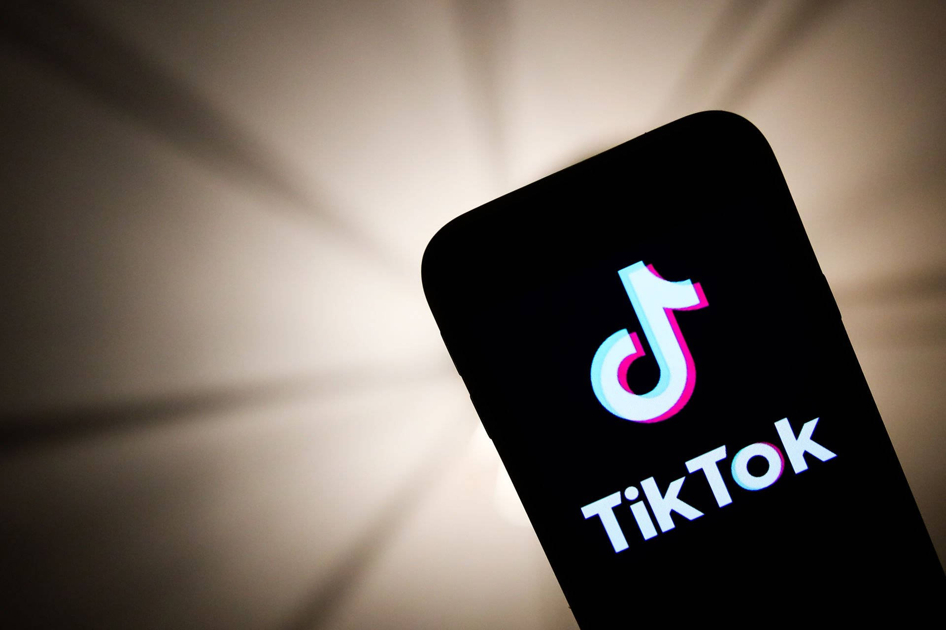 TikTok Logo Displayed At Phone Screen Wallpaper