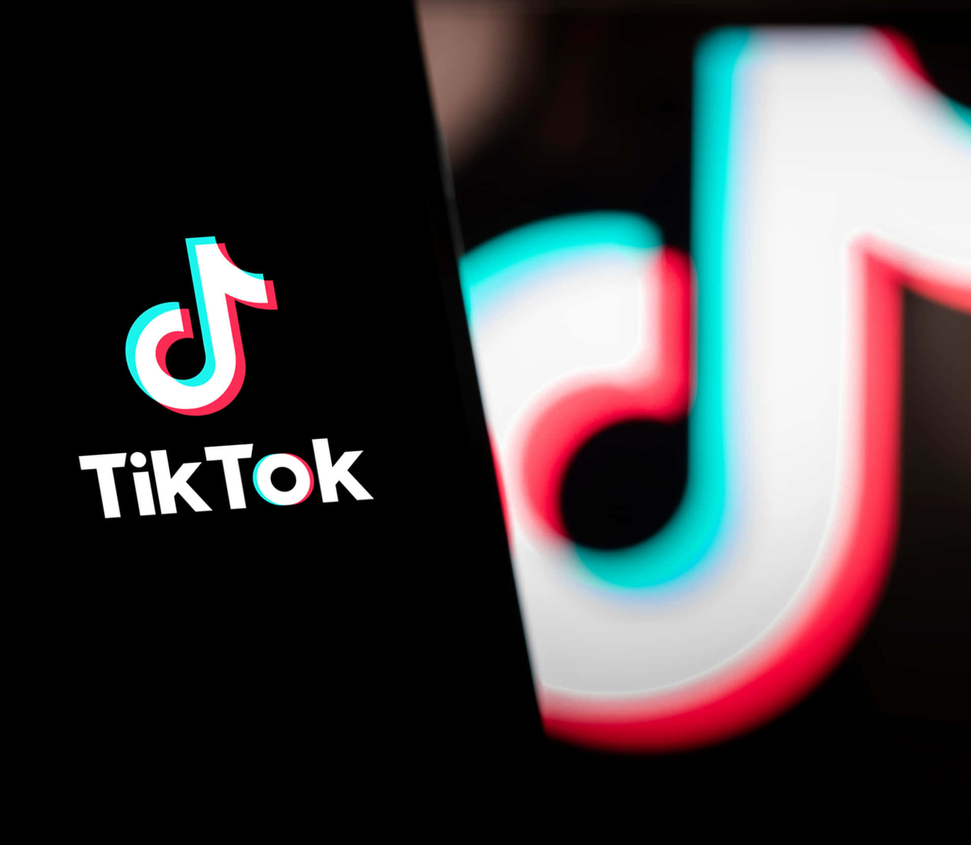 tiktok logo with a black background Wallpaper
