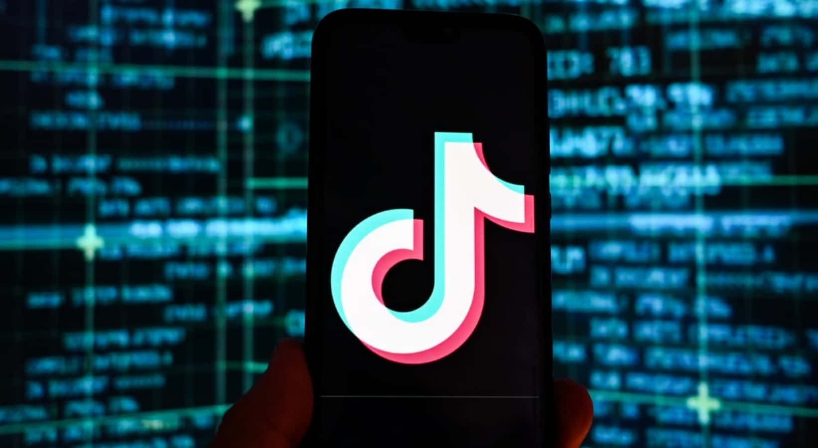 A Person Is Holding Up A Phone With The Tiktok Logo On It