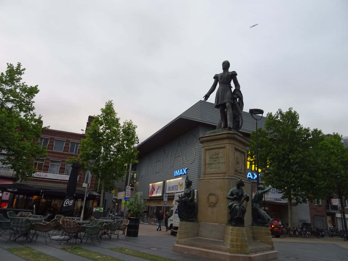 Download Tilburg City Center Statueand I M A X Wallpaper | Wallpapers.com