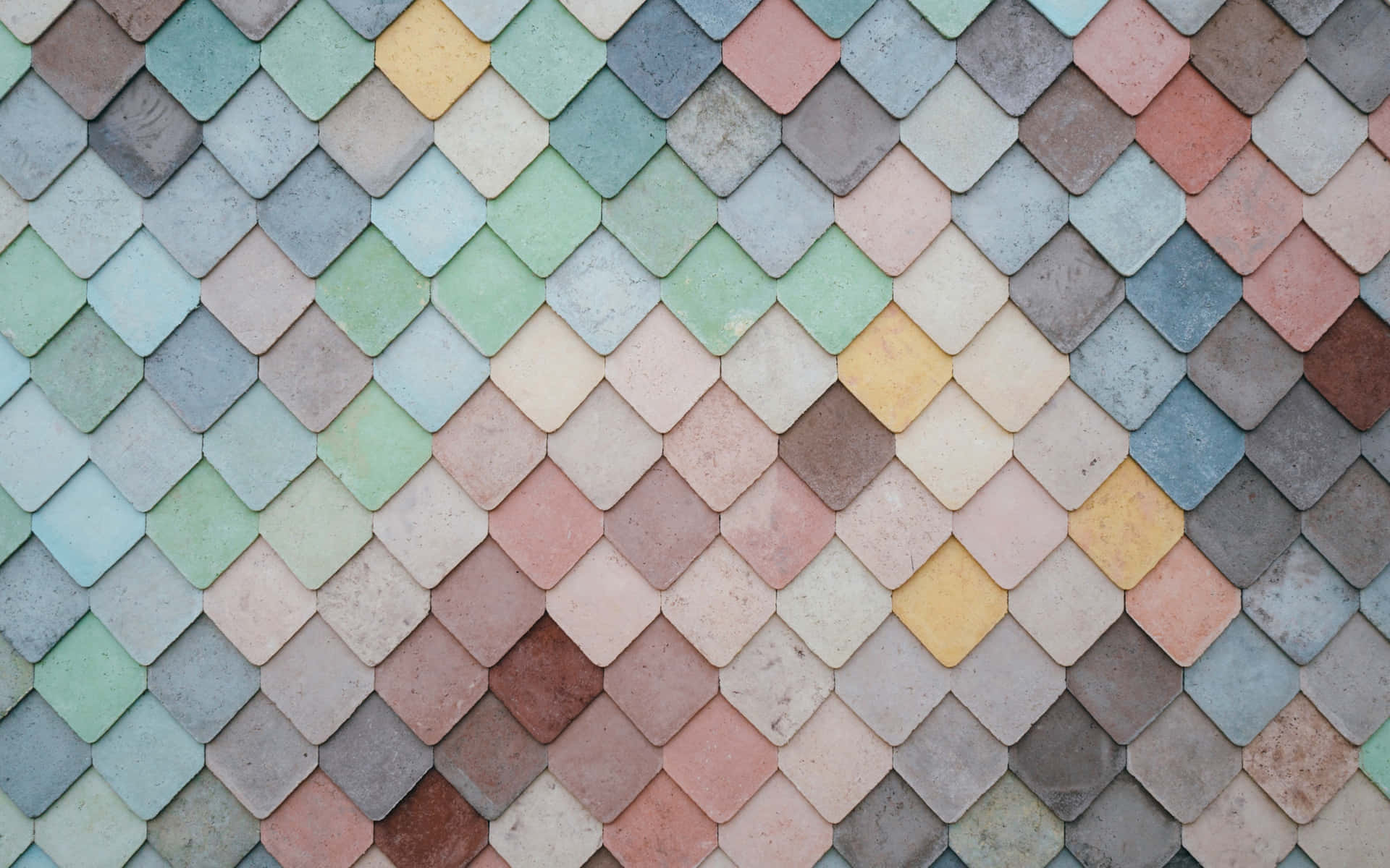 A Colorful Tiled Wall With Different Colored Tiles