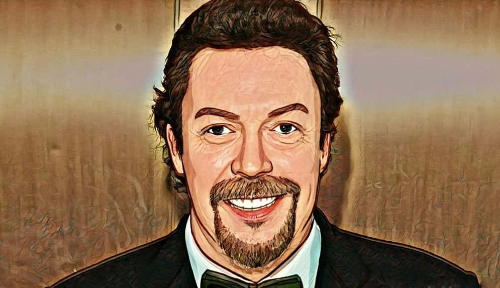 A charismatic Tim Curry grinning in a close-up shot Wallpaper