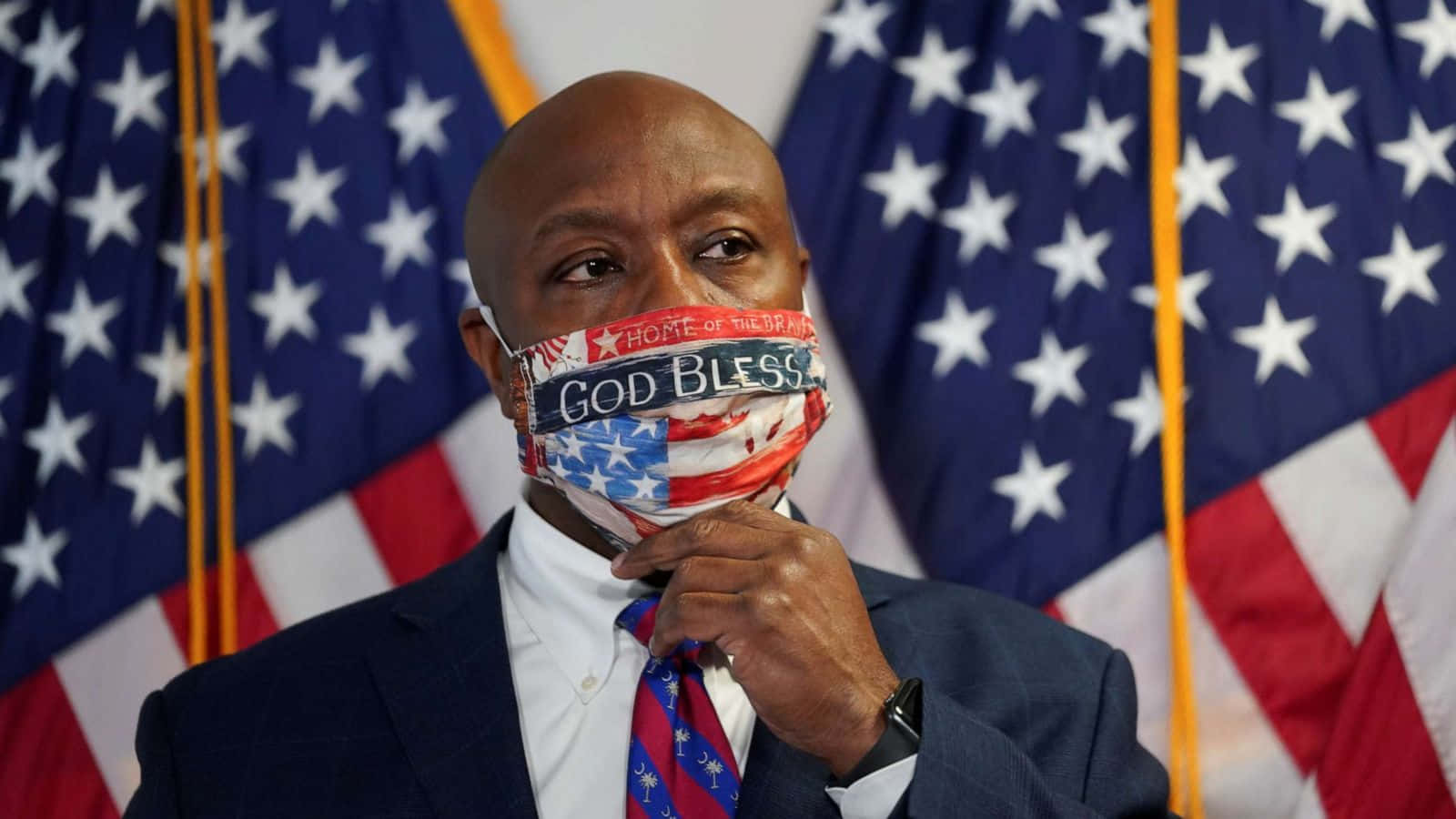 Senator Tim Scott wearing a patriotic 'God Bless America' face mask Wallpaper
