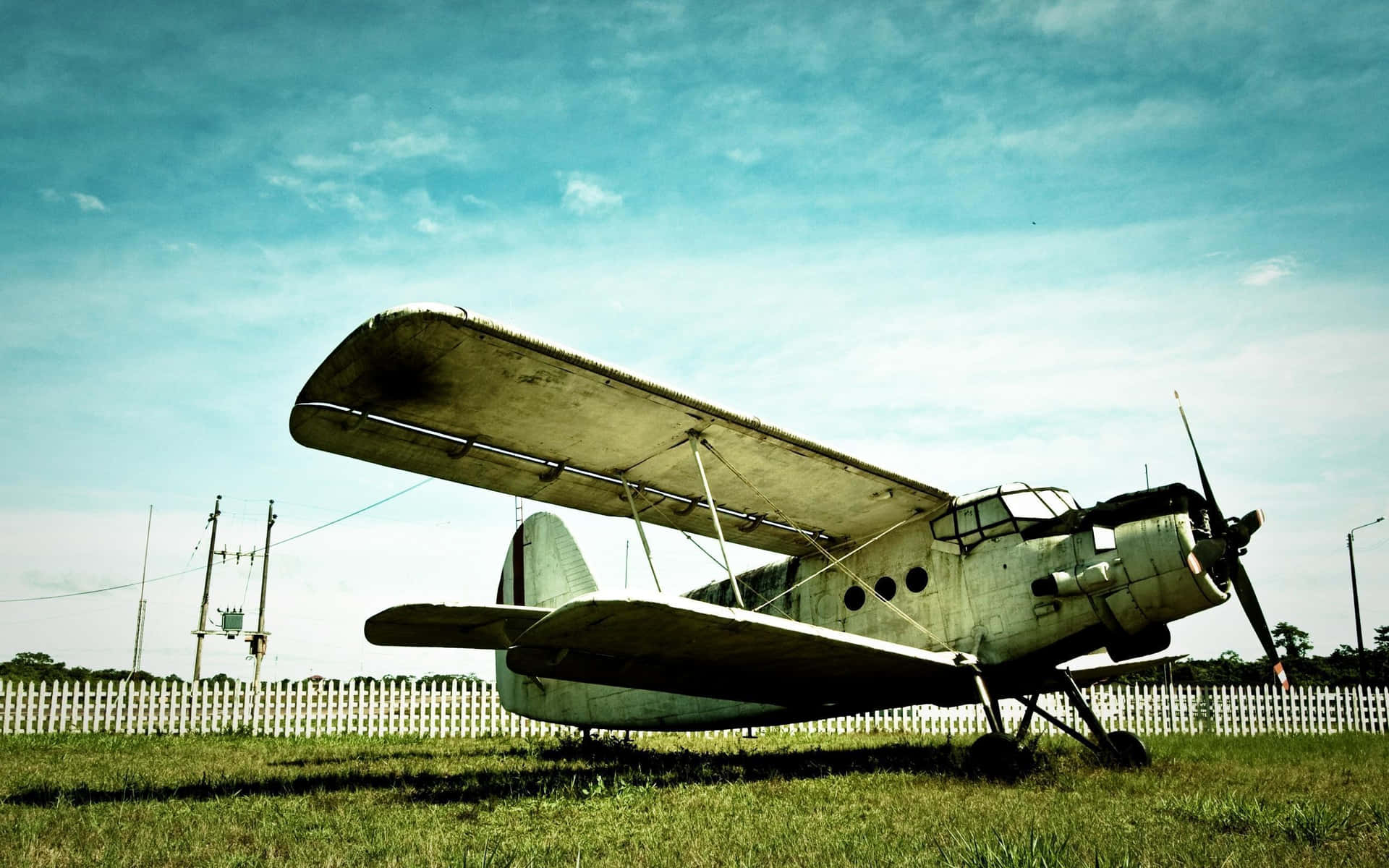 Timeless Flight - Vintage Airplane Against The Sunset Wallpaper