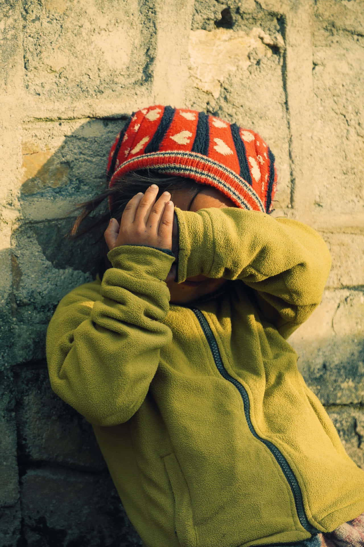 Timid Child Hiding Face Wallpaper
