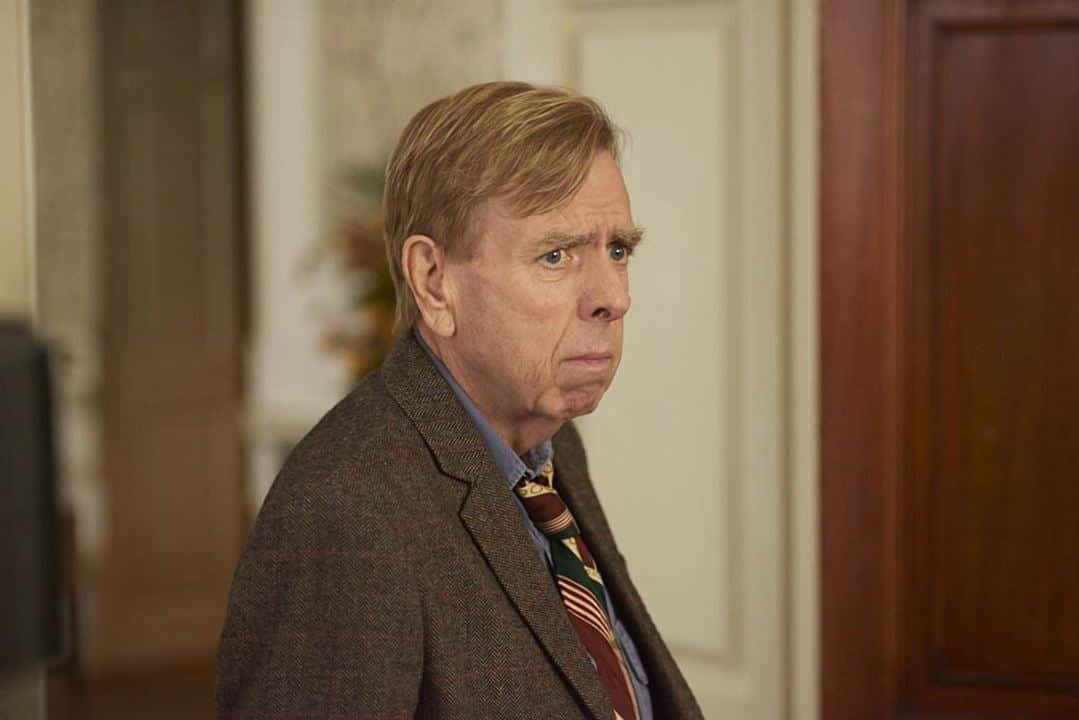 Award-winning actor Timothy Spall in a contemplative pose Wallpaper