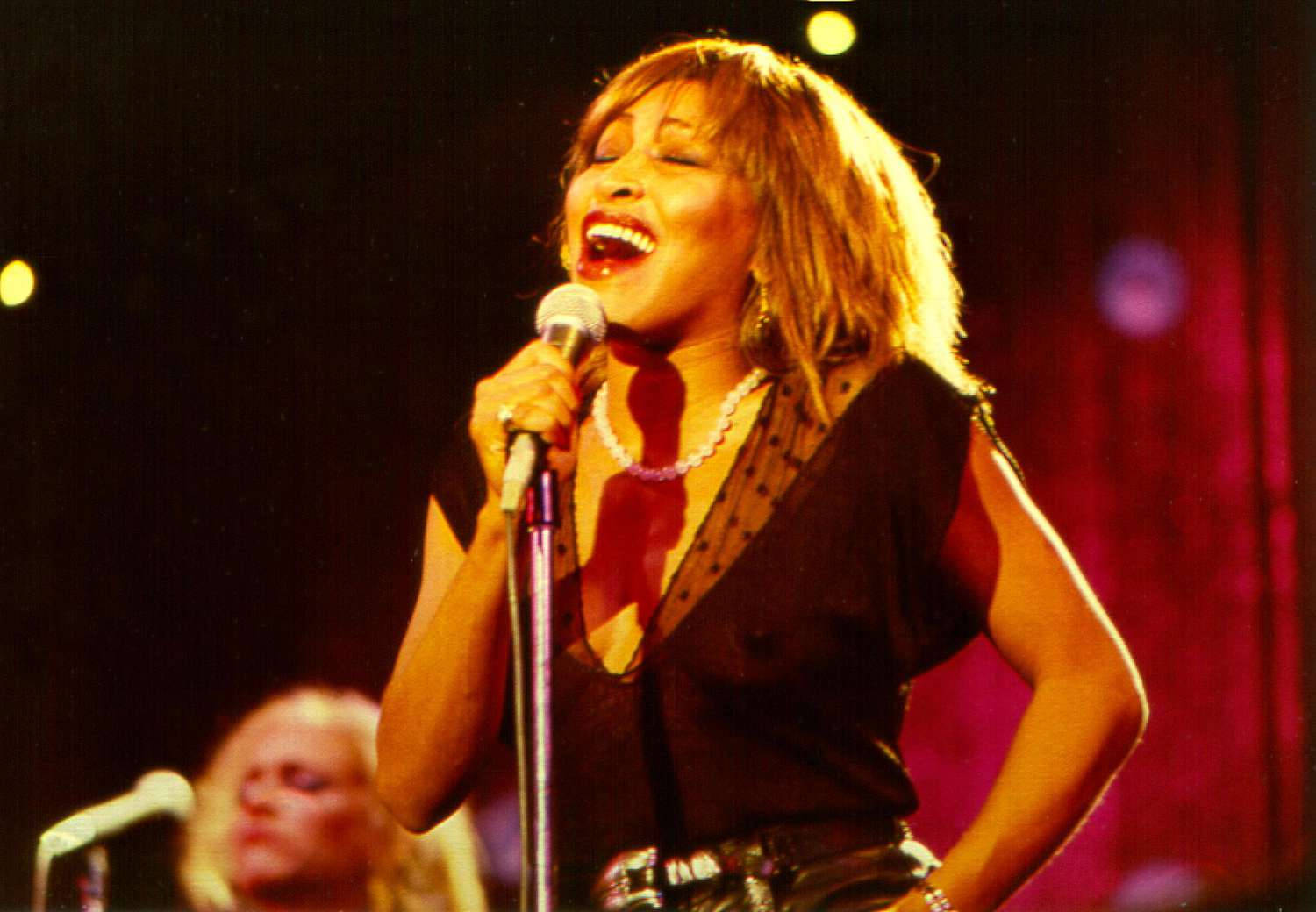 Tina Turner Live Song Performance Wallpaper