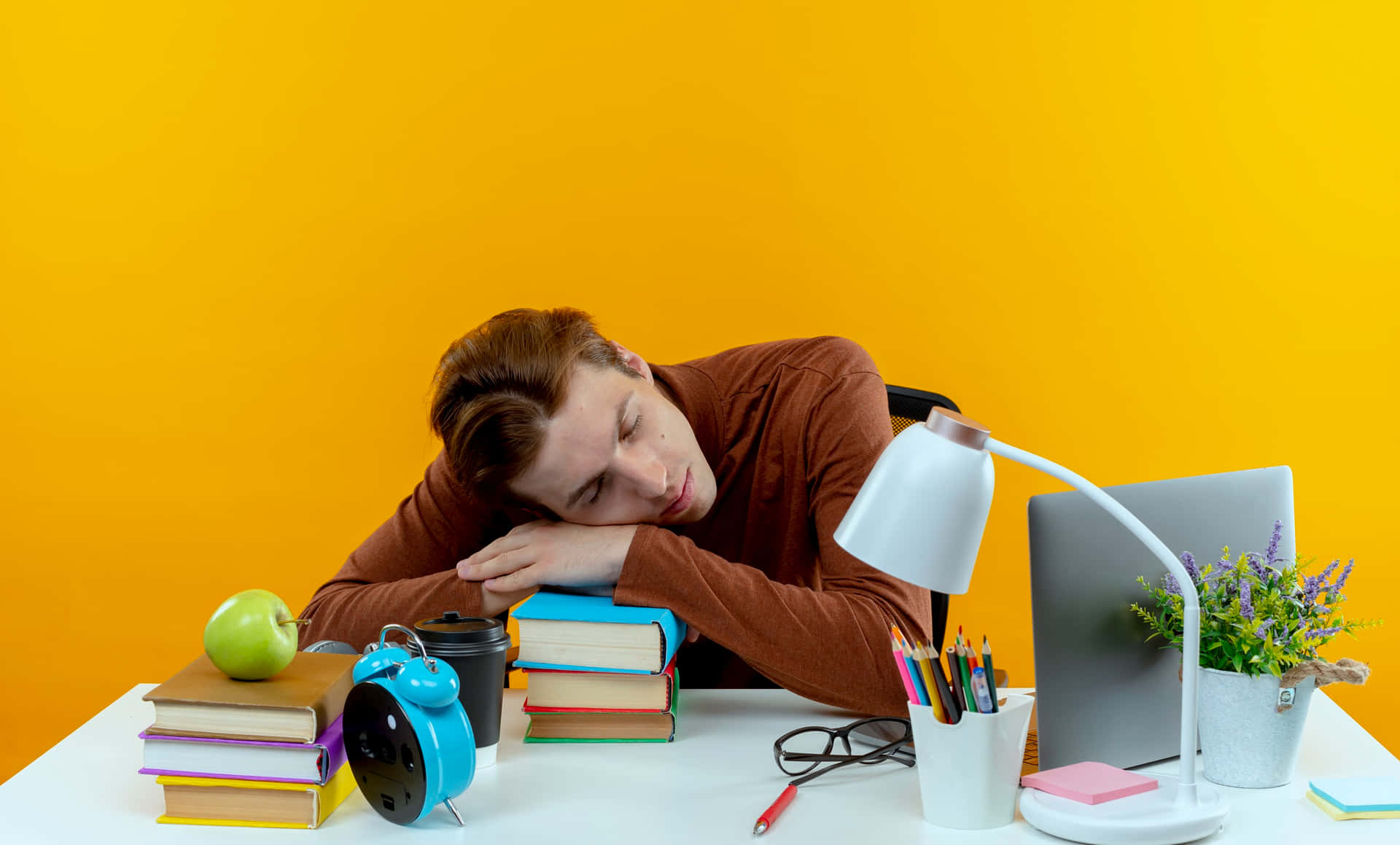 Tired Student Asleepat Desk.jpg Wallpaper