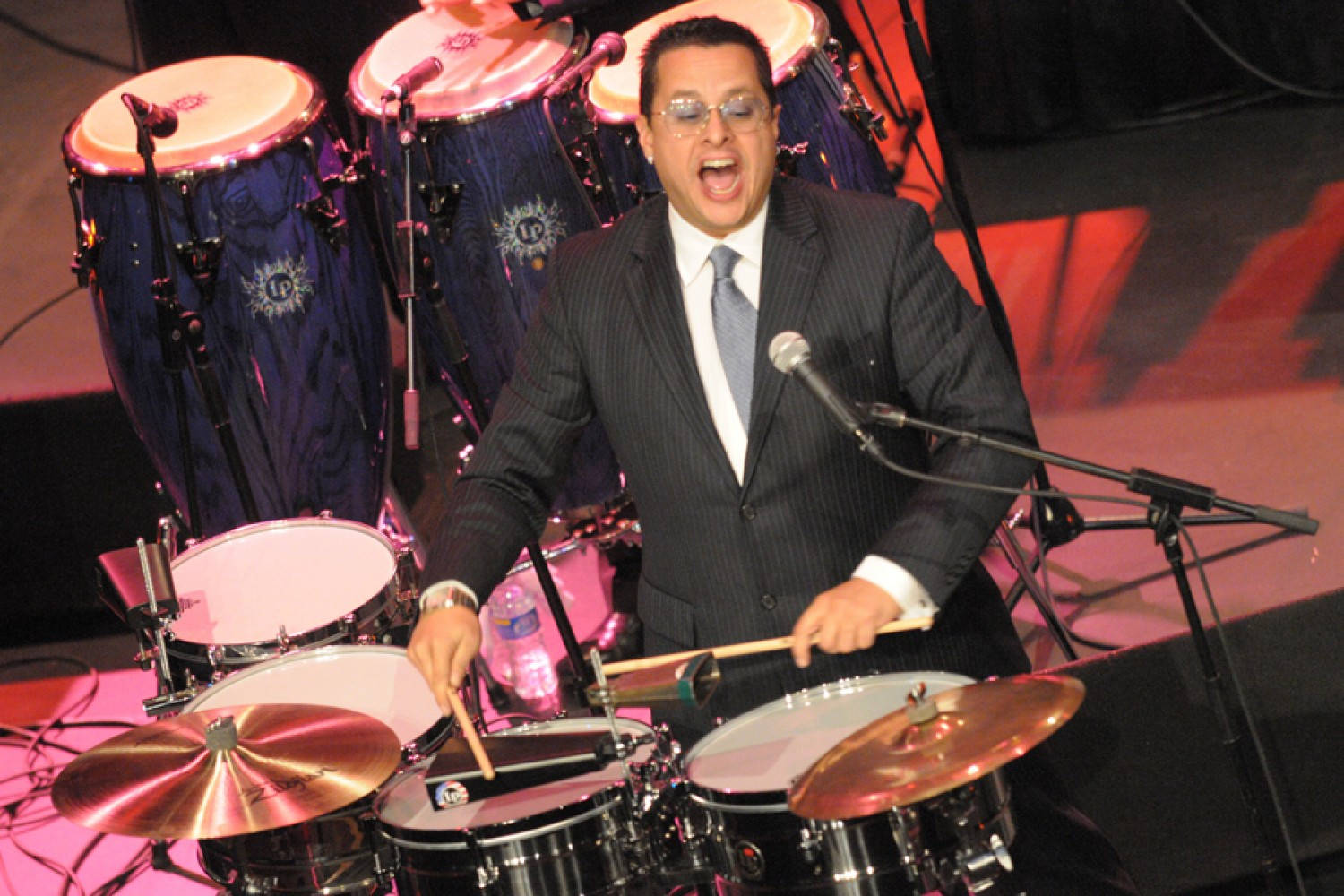Tito Puente Singing And Drumming Wallpaper
