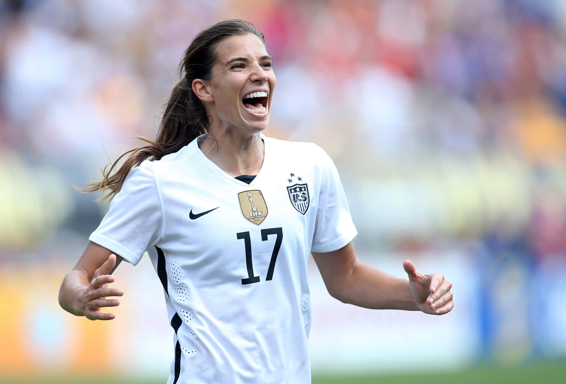 Tobin Heath In Action On The Soccer Field Wallpaper