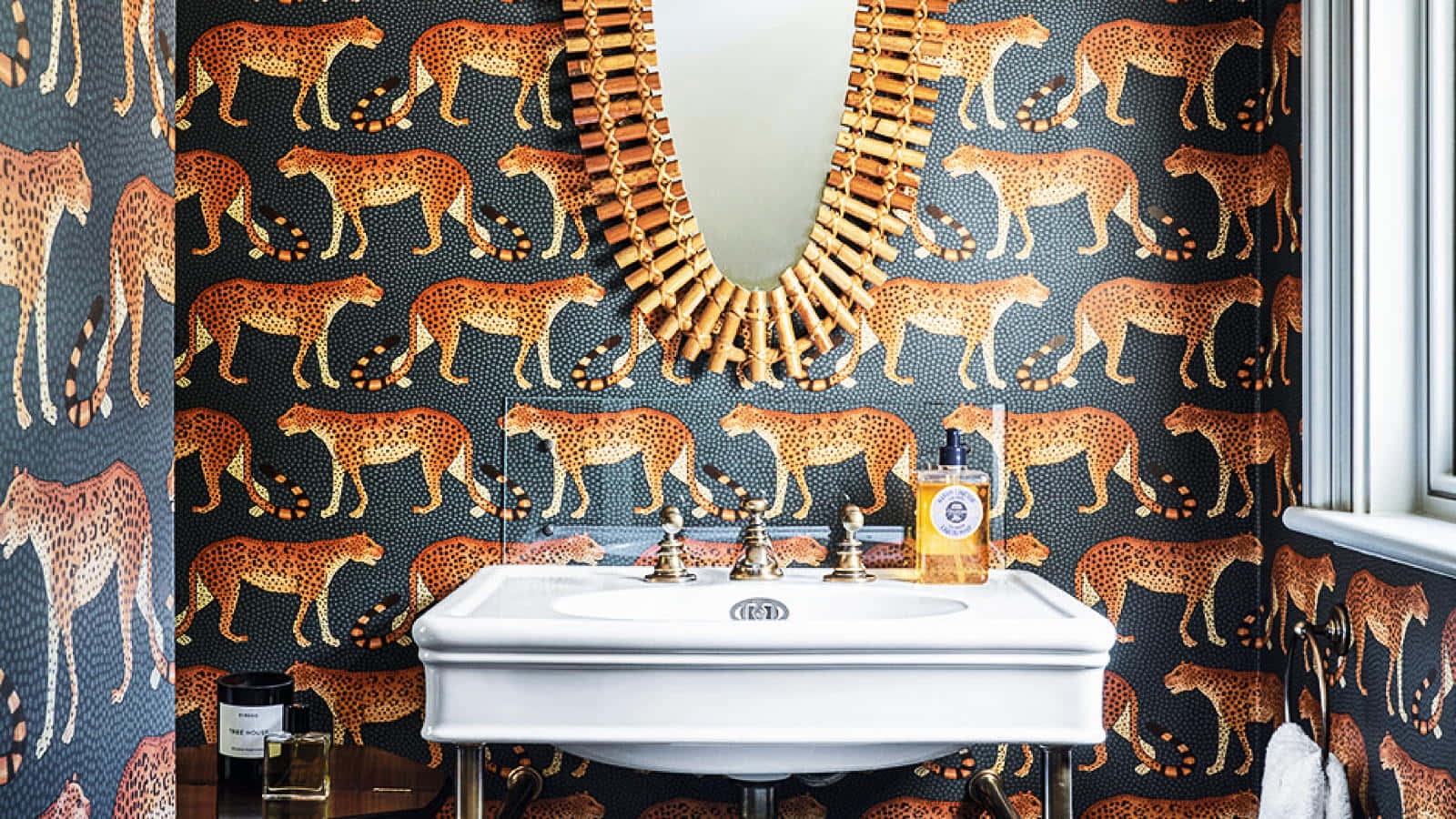A Bathroom With Cheetah Print Wallpaper