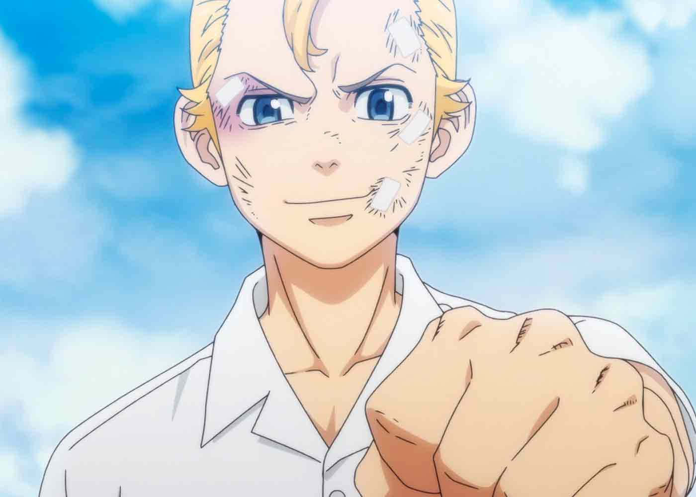 A Man With Blond Hair And Blue Eyes Is Pointing His Fist