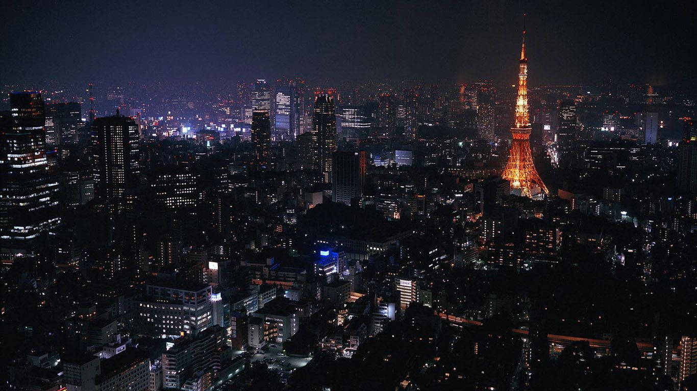 Aerial view wallpaper of Tokyo Tower in the city at night 