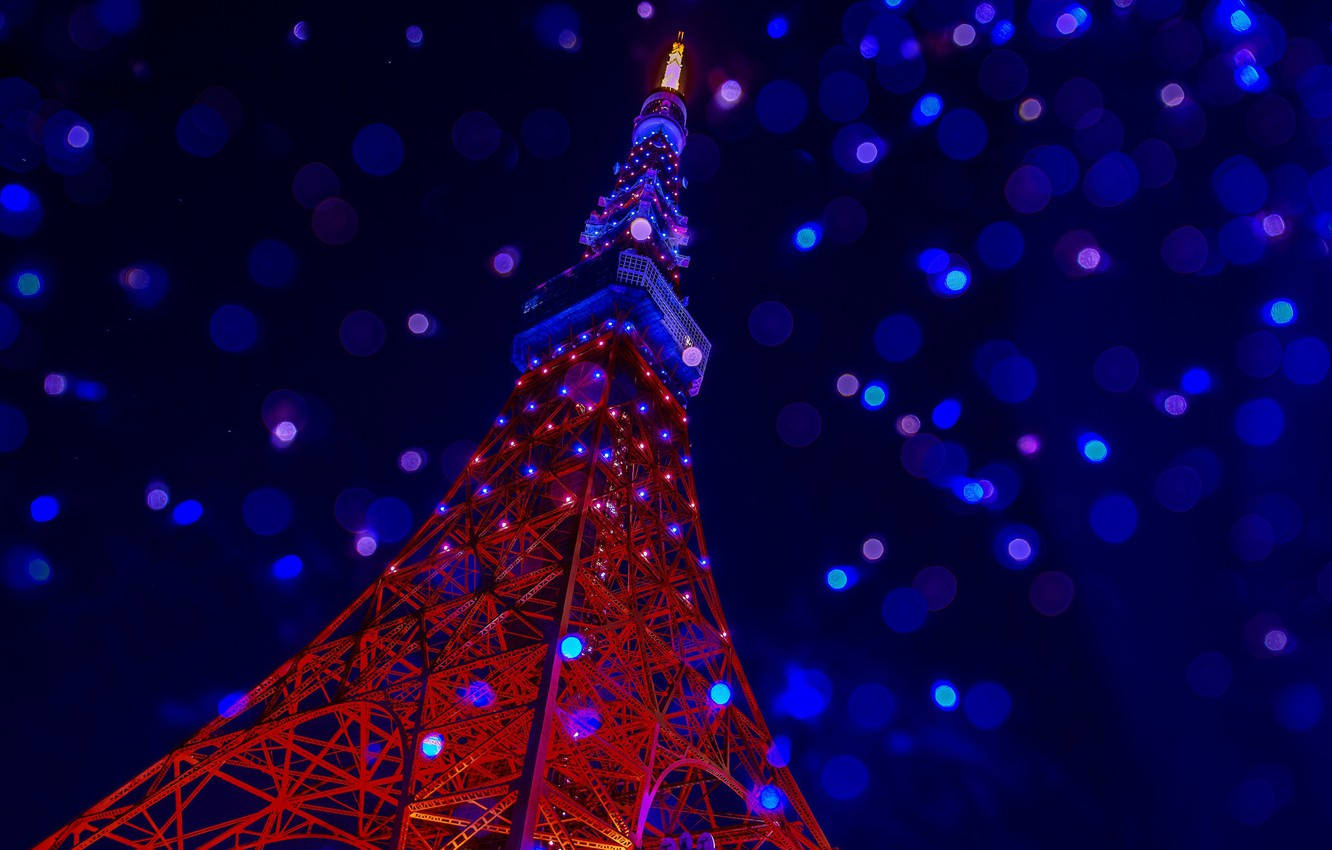 Tokyo Tower Photographed With Defocused Lights Wallpaper