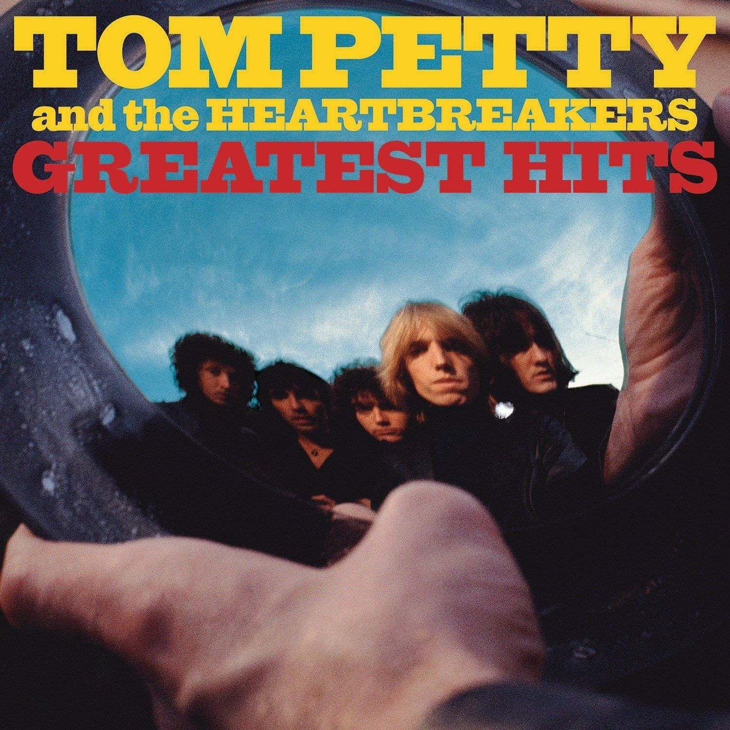 Albumcover af Tom Petty and the Heartbreakers Bedste Hits på skrivebordet Wallpaper