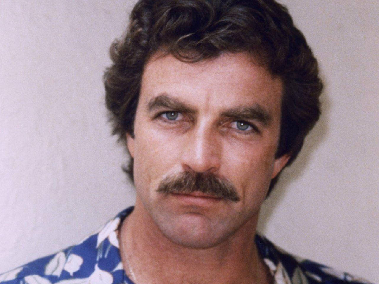 A Close-up Striking Headshot of Tom Selleck from the 1970s Wallpaper