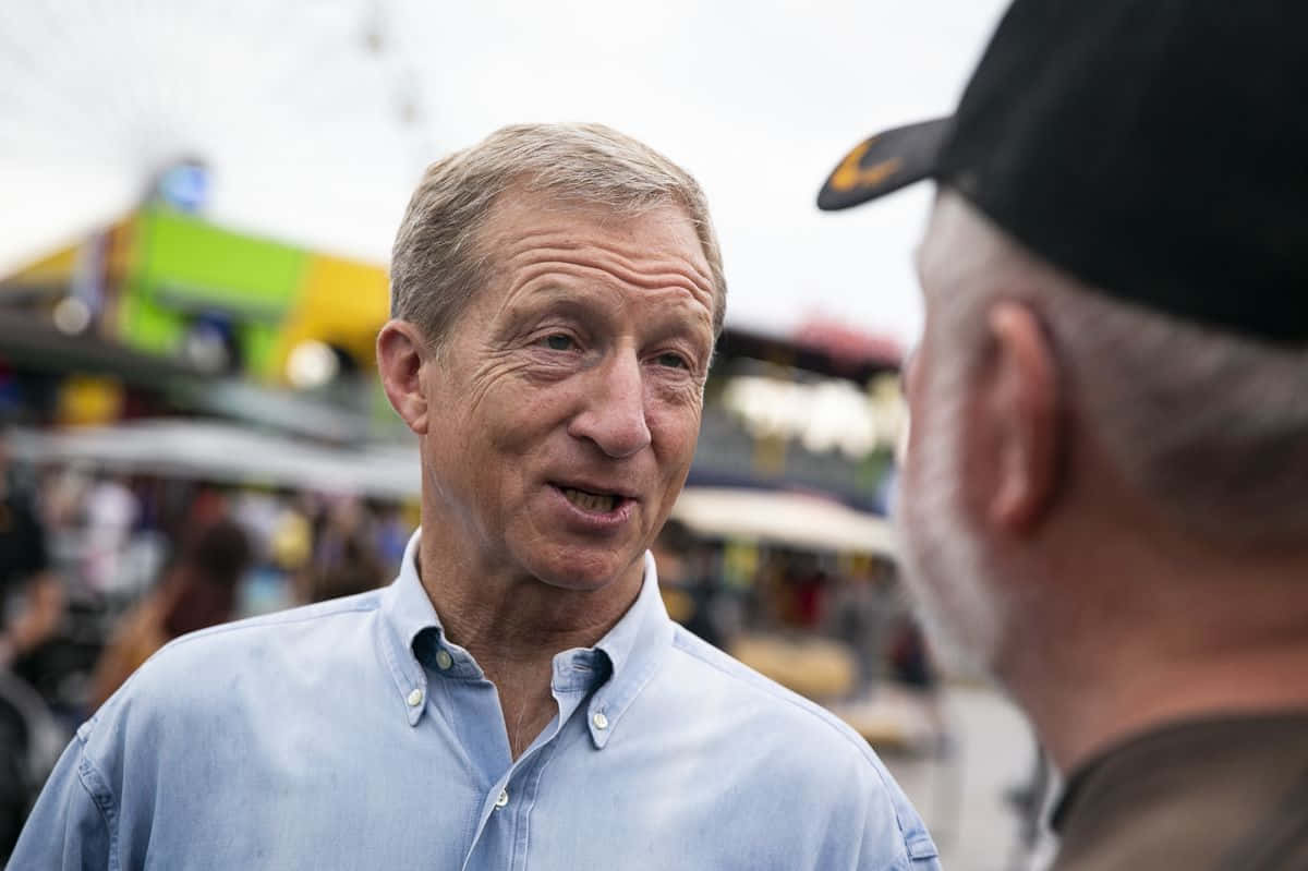 Tom Steyer With A Man In Cap Wallpaper