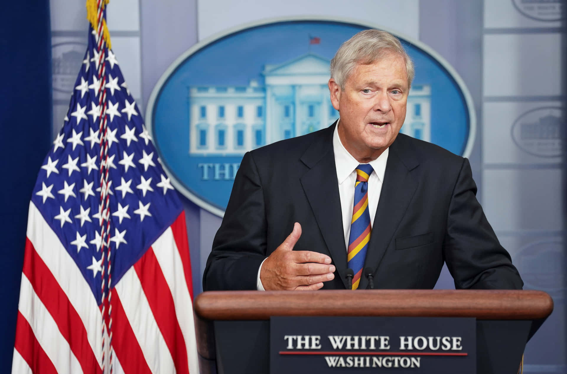 Former United States Secretary of Agriculture Tom Vilsack speaking at a press conference Wallpaper