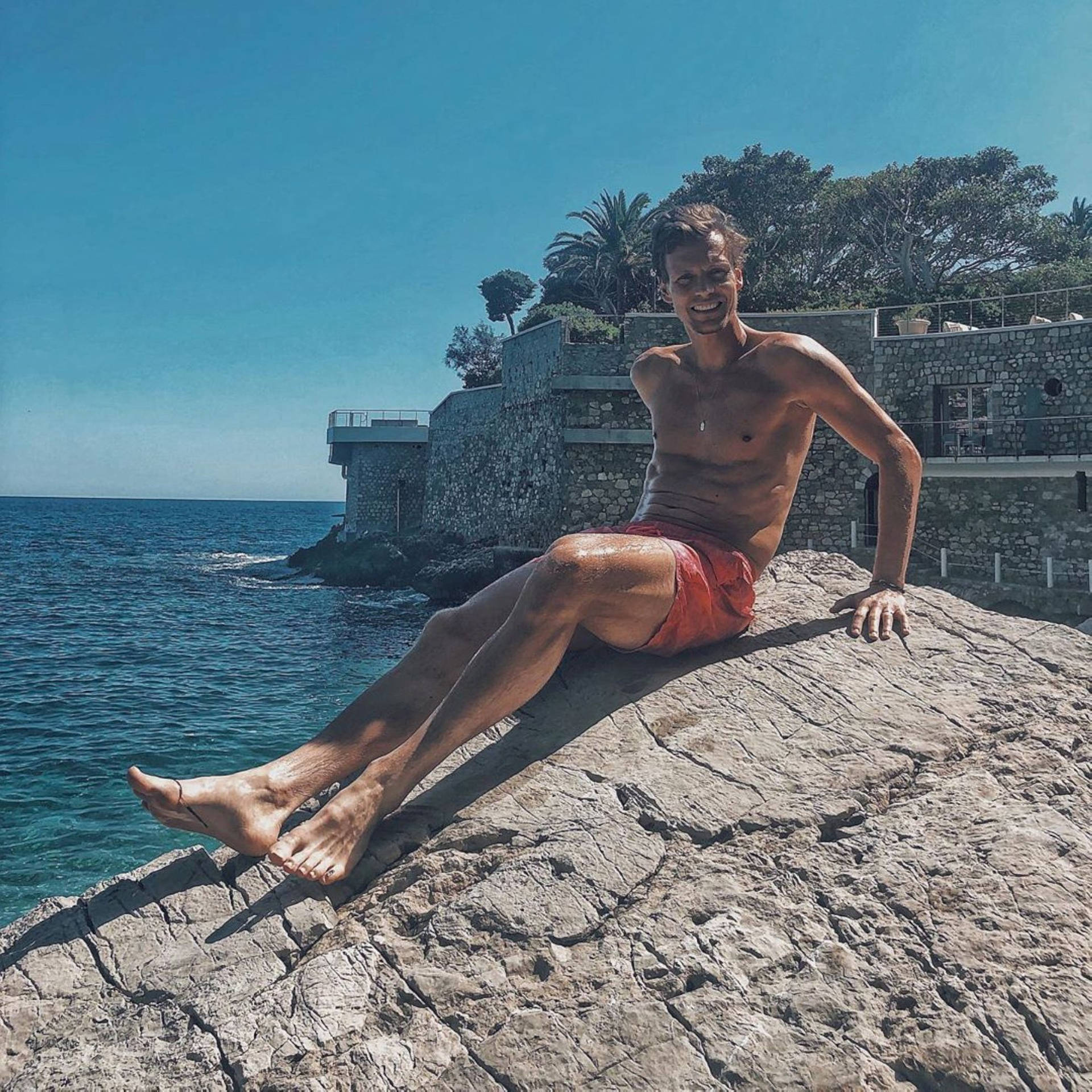 Tomas Berdych Sitting On Rock Picture