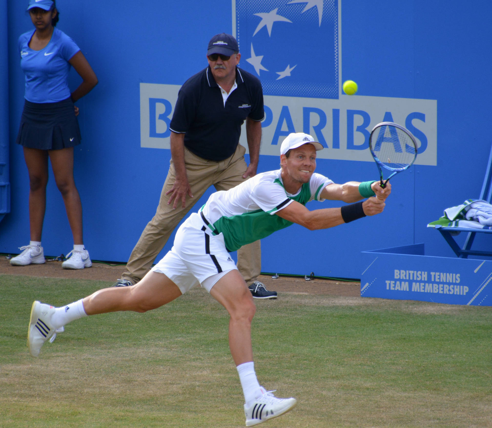 Tomas Berdych Trying To Hit Yellow Ball Wallpaper