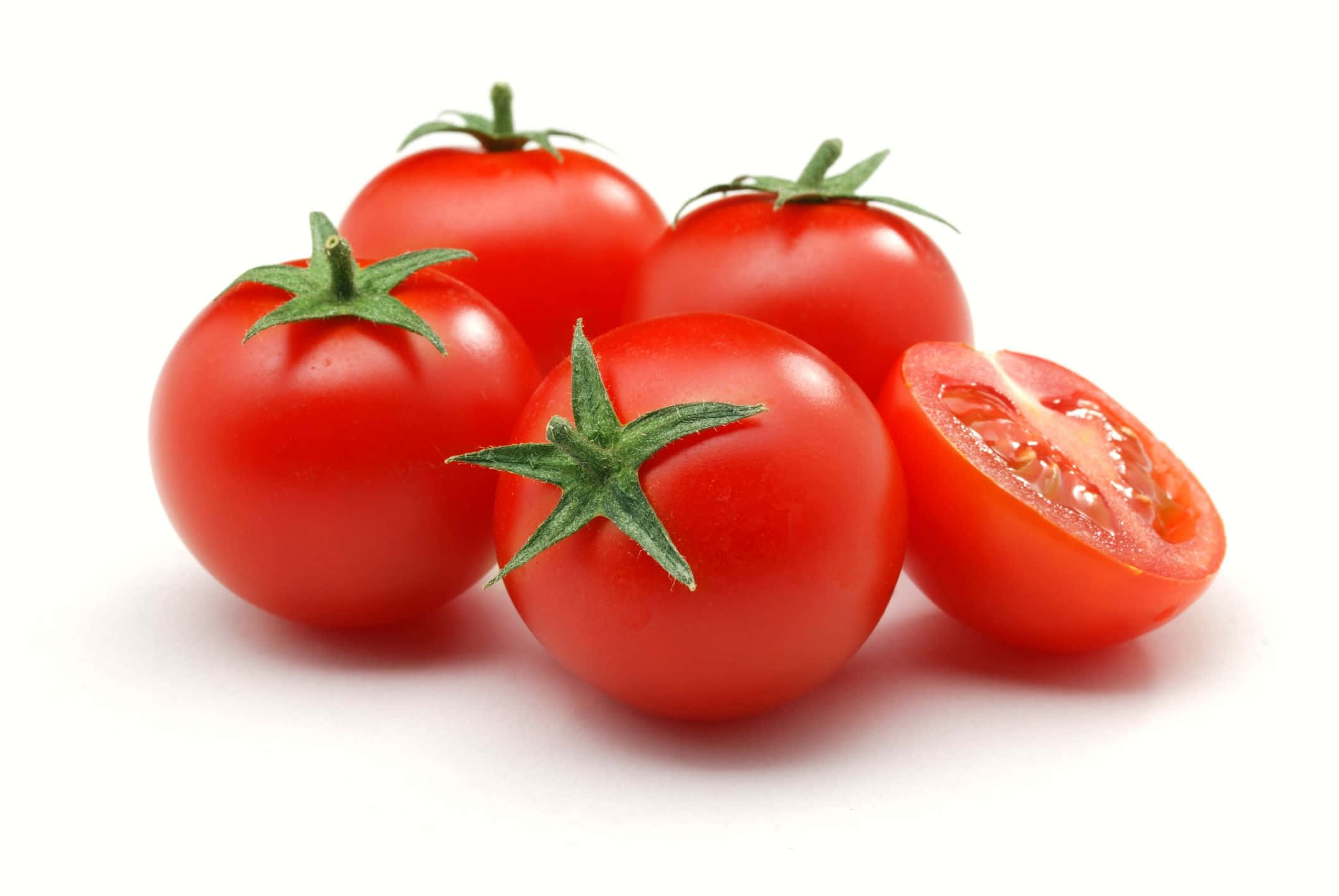 A juicy red tomato glistening in the sun